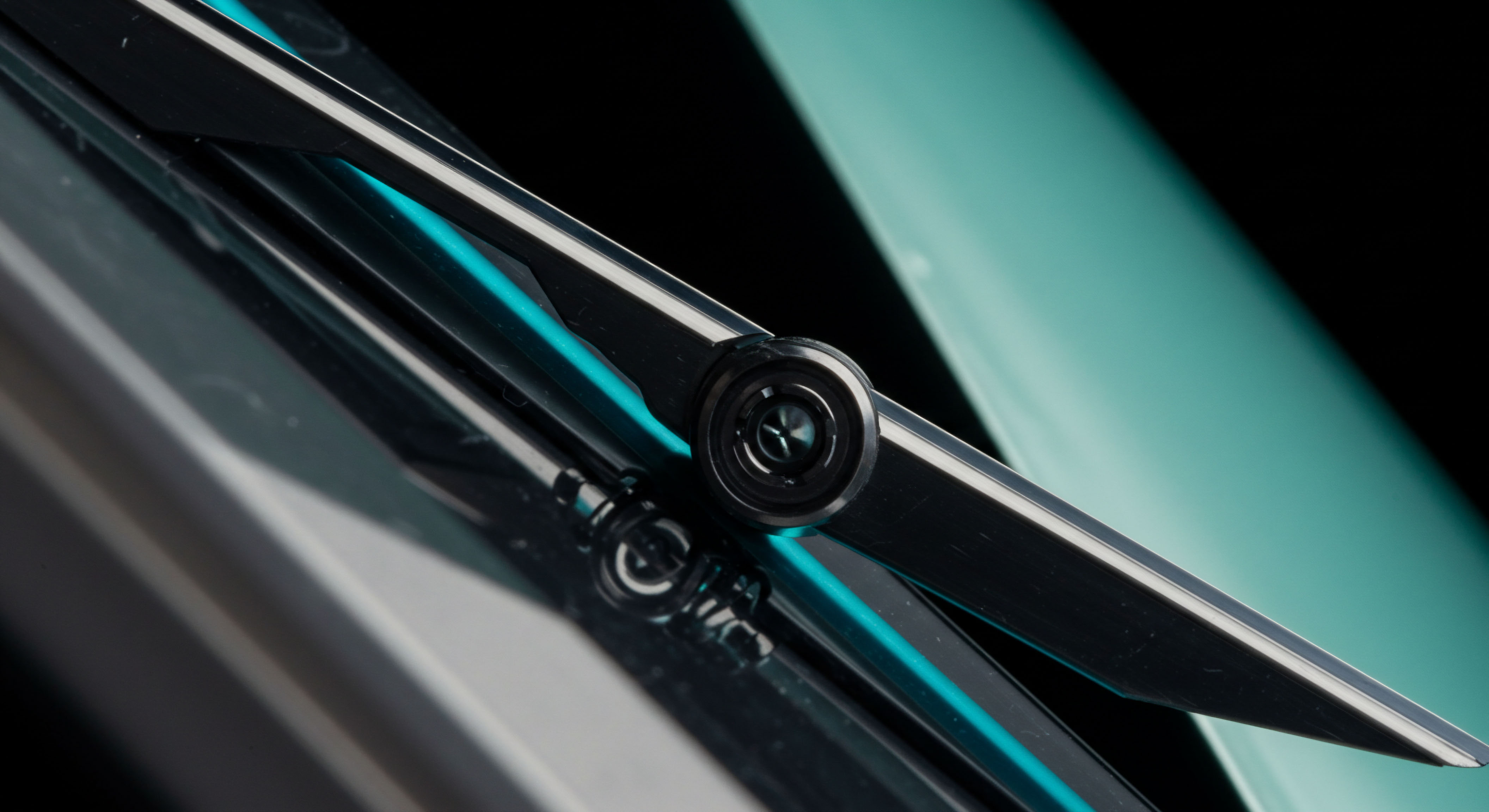 Reflecting sleek, high-gloss mechanical articulation a central pivot point suggests deterministic execution mechanisms vital for complex perpetual futures contracts and dynamic option pricing models. The sharp interface between dark carbon structures and cyan light accents visualizes the tight spreads achievable in efficient decentralized finance infrastructure. This aesthetic embodies the relentless pursuit of arbitrage opportunities across volatile digital asset spot and derivative exchanges. It hints at the robustness required for layer two scaling solutions ensuring rapid finality and minimized slippage during intense market microstructure events like flash crashes or significant liquidity infusions affecting covered call writing strategies on exotic tokens. The reflection implies mirroring risk management protocols necessary for maintaining collateralization ratios within leveraged DeFi positions.