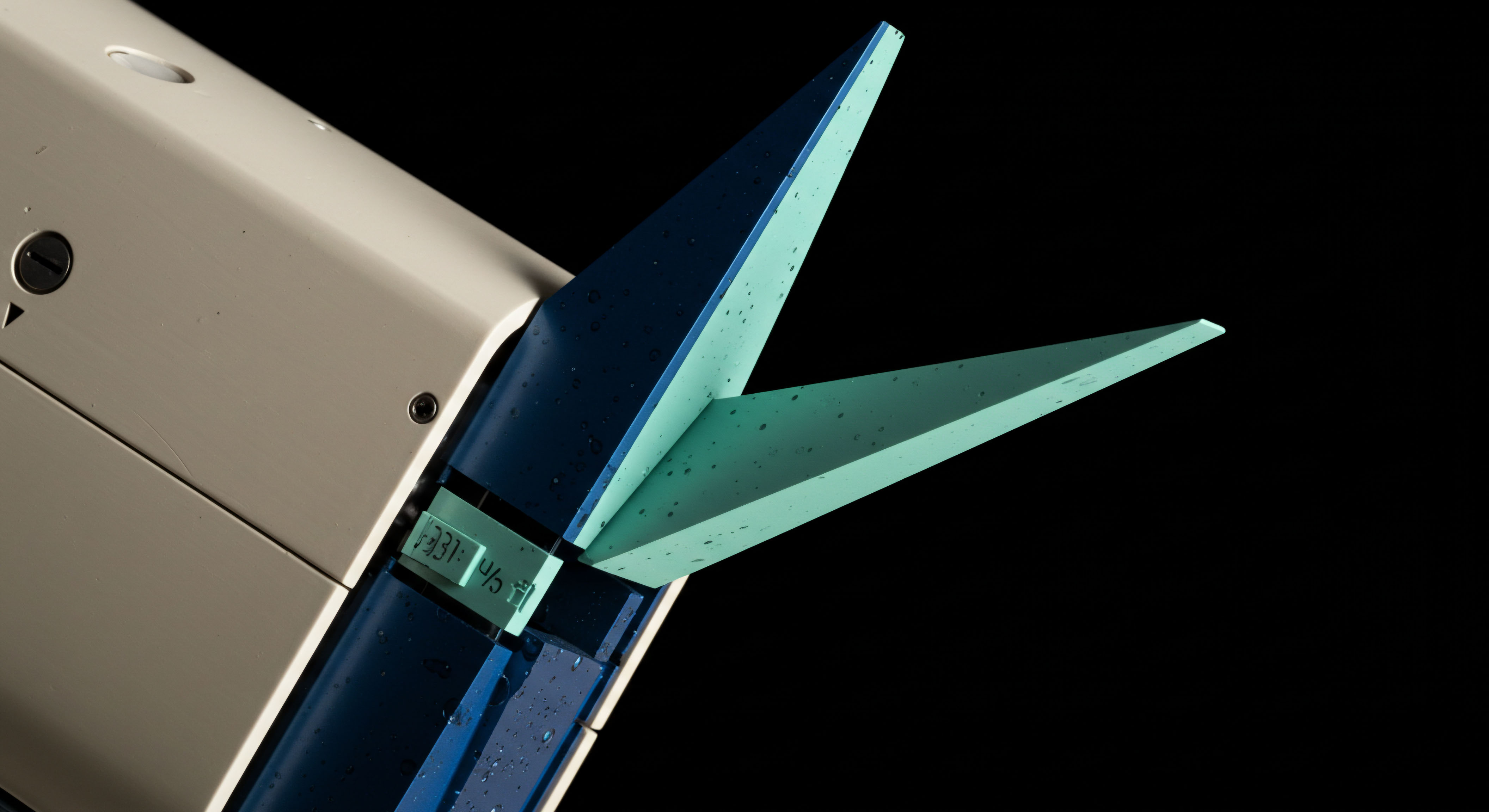 The visual captures a stark, angular juxtaposition resembling open scissor blades against absolute black. This design metaphorically represents an imbalance in synthetic asset management, specifically the diverging spread between bid and ask liquidity profiles during volatile crypto futures settlements. The sharp, mint-green and deep navy facets imply discrete structural components of an automated market maker interface or an optimized cross-margin collateral deployment strategy. Speckling on the surfaces suggests execution friction or slippage incurred during high-frequency options delta hedging maneuvers across decentralized exchanges. This configuration visualizes the critical decision point in high-stakes DeFi governance tokens requiring rapid portfolio unwinding or aggressive capital rotation leveraging immutable ledger mechanics. The implied force vector speaks to the transient nature of realized volatility versus implied volatility pricing in perpetual swaps.