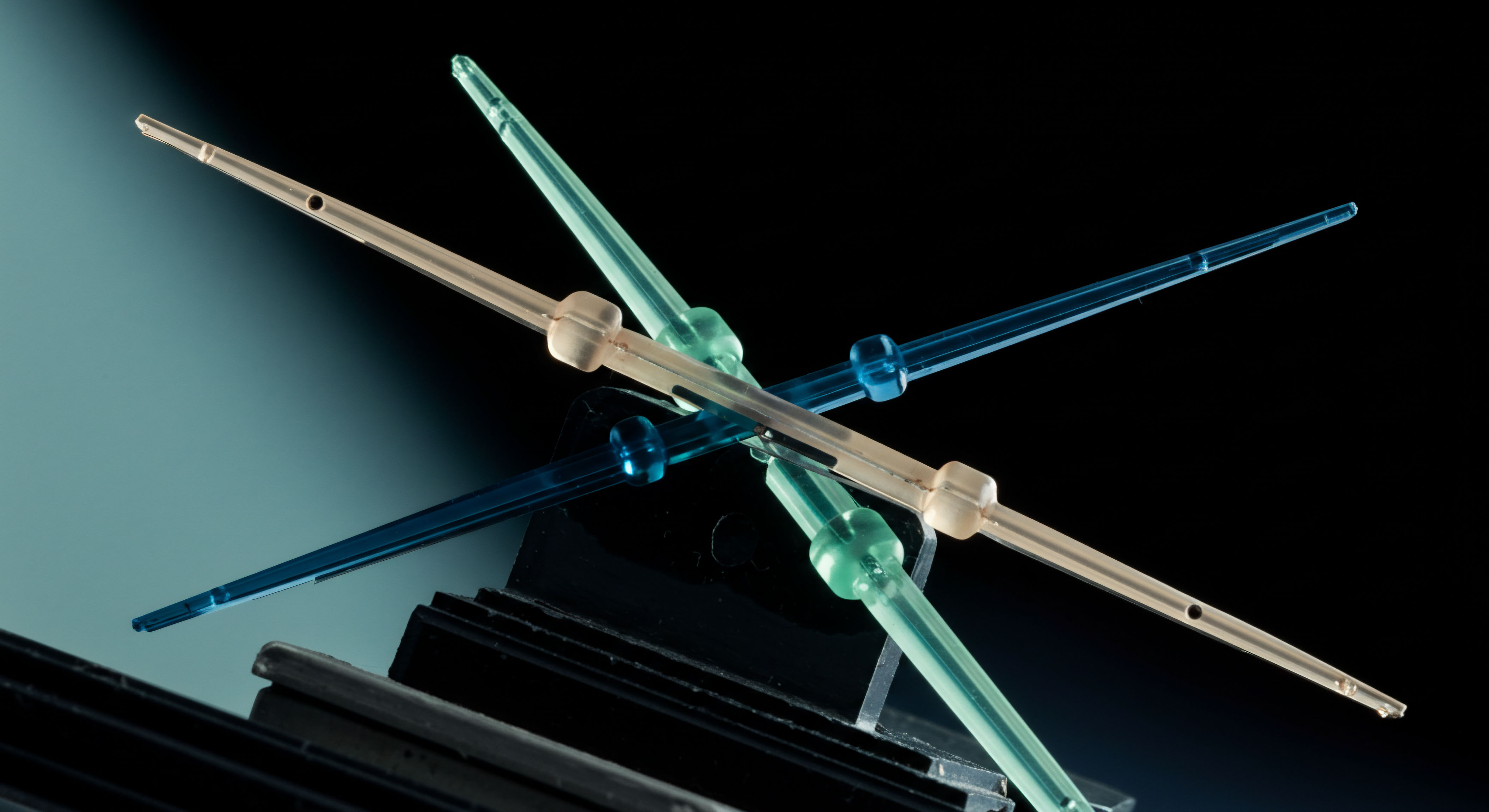 Translucent, intersecting linear structures tinted cyan, amber, and cerulean suggest entangled financial conduits representing complex derivatives settlement layers. This configuration embodies the intricate interdependency within decentralized finance DeFi protocols, specifically visualizing collateralized debt positions CDP structures or overlapping options book exposures. The structure's central node symbolizes the immutable ledger recording all settlement and liquidation events across disparate blockchain environments. Keywords include collateralized borrowing asset pegging synthetic shorting basis risk smart contract audit mechanism and cross-chain atomic swap execution. The ethereal lighting implies the speculative nature inherent in leveraged futures trading and the transparency of on-chain recorded derivatives valuation matrices requiring rigorous oracle feed verification.