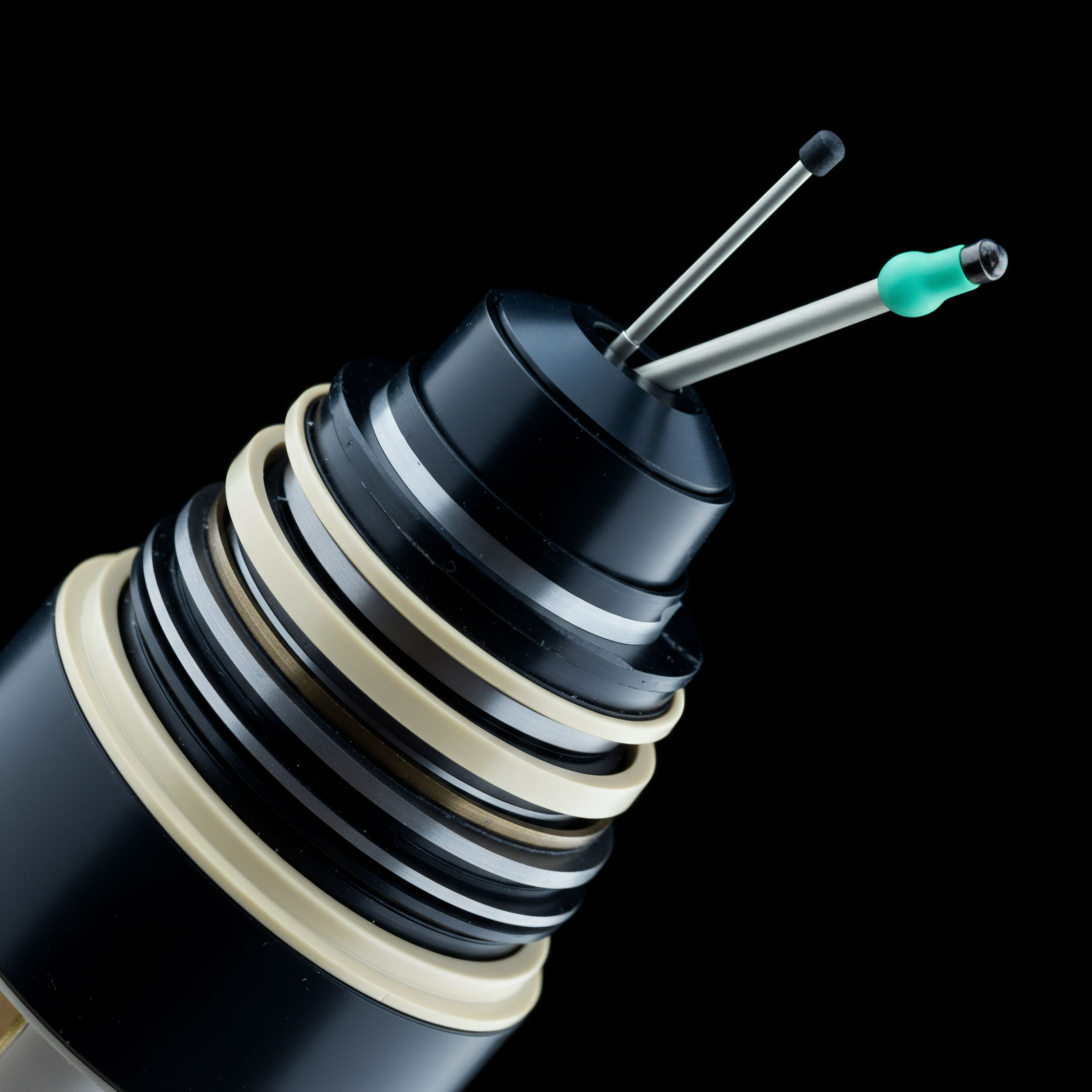 This schematic close-up reveals stacked, alternating strata of black polymeric and pale beige elastomeric rings terminating in two protruding metallic probes, one capped with a black sphere and the other with a teal terminus, against a stark black void. This configuration visually models the multi-layered governance architecture of a bespoke Decentralized Finance DeFi Automated Market Maker AMM liquidity provisioning system. The concentric layers suggest depth in smart contract staking tiers, reflecting complex collateralization ratios and varying levels of vesting schedules within leveraged perpetual futures mechanisms. The exposed probes evoke interaction points, perhaps representing oracle data feeds or active margin calls on a high-frequency algorithmic trading engine utilizing on-chain settlement layer infrastructure for rapid derivative execution and immutable audit trails across a permissionless ledger.