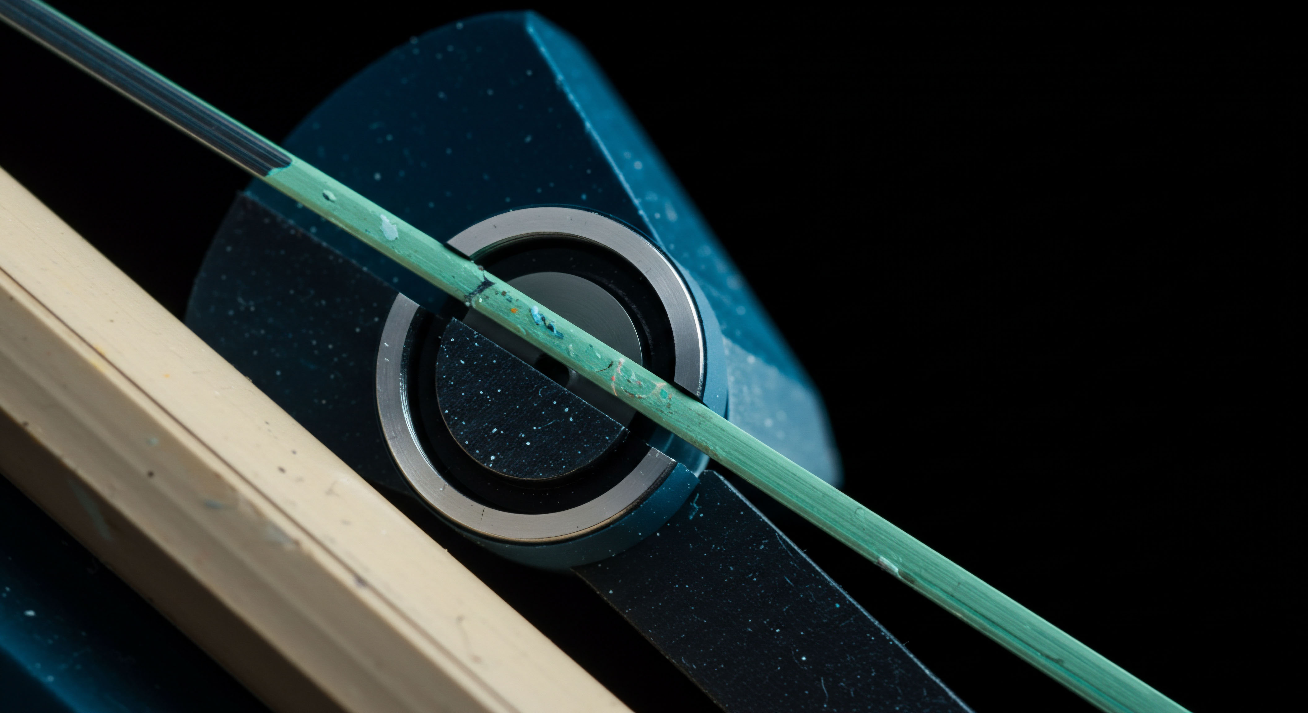 This high-contrast macro photograph depicts a slender, verdigris-streaked cyan rod intersecting a textured, deep-blue housing featuring metallic concentric rings, set against an absolute black field. A pale, chamfered element occupies the lower left quadrant, suggesting underlying infrastructure. Conceptually, this represents the delicate equilibrium inherent in decentralized finance protocols, specifically illustrating the fragile execution path during cross-chain bridge validation or a complex options clearing process. The cyan element signifies a volatile asset trajectory or a leveraged position under stress, perhaps embodying a liquidity pool under significant withdrawal pressure. The static housing suggests the immutable smart contract logic governing execution. Keywords include: Impermanent Loss Mitigation Flash Loan Arbitrage Settlement Finality Collateralization Ratio Option Greeks Theta Decay Basis Risk Analysis Stablecoin Peg Maintenance.