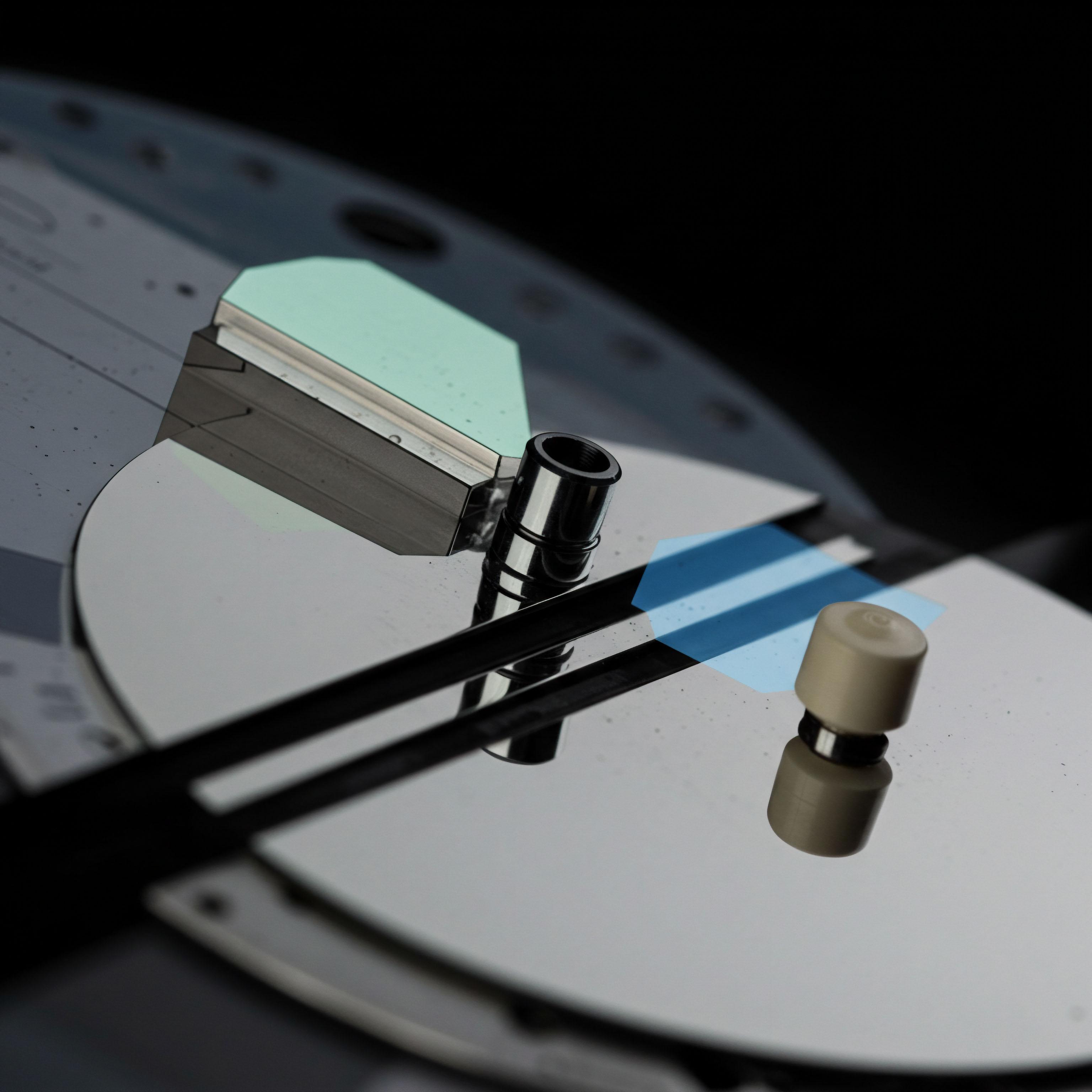This macro view reveals polished metallic surfaces resembling a complex computational substrate or high-precision optical array fundamental to algorithmic execution. The subtle greenish-blue light reflection suggests advanced material science underpinning transparent settlement layers or quantum-resistant encryption structures vital for institutional DeFi integration. Key elements ▴ a cylindrical conduit and a matte termination component ▴ suggest critical infrastructure like a liquidity pool interface or a specialized oracle feed mechanism influencing option pricing models and synthetic asset valuation. Focus on slippage minimization, delta hedging protocols, and ensuring fair value discovery across decentralized exchanges DEXs defines this intricate setting, emphasizing robust execution frameworks beyond simple spot trading. The mirrored finish reflects potential arbitrage windows within cross-chain bridging solutions.