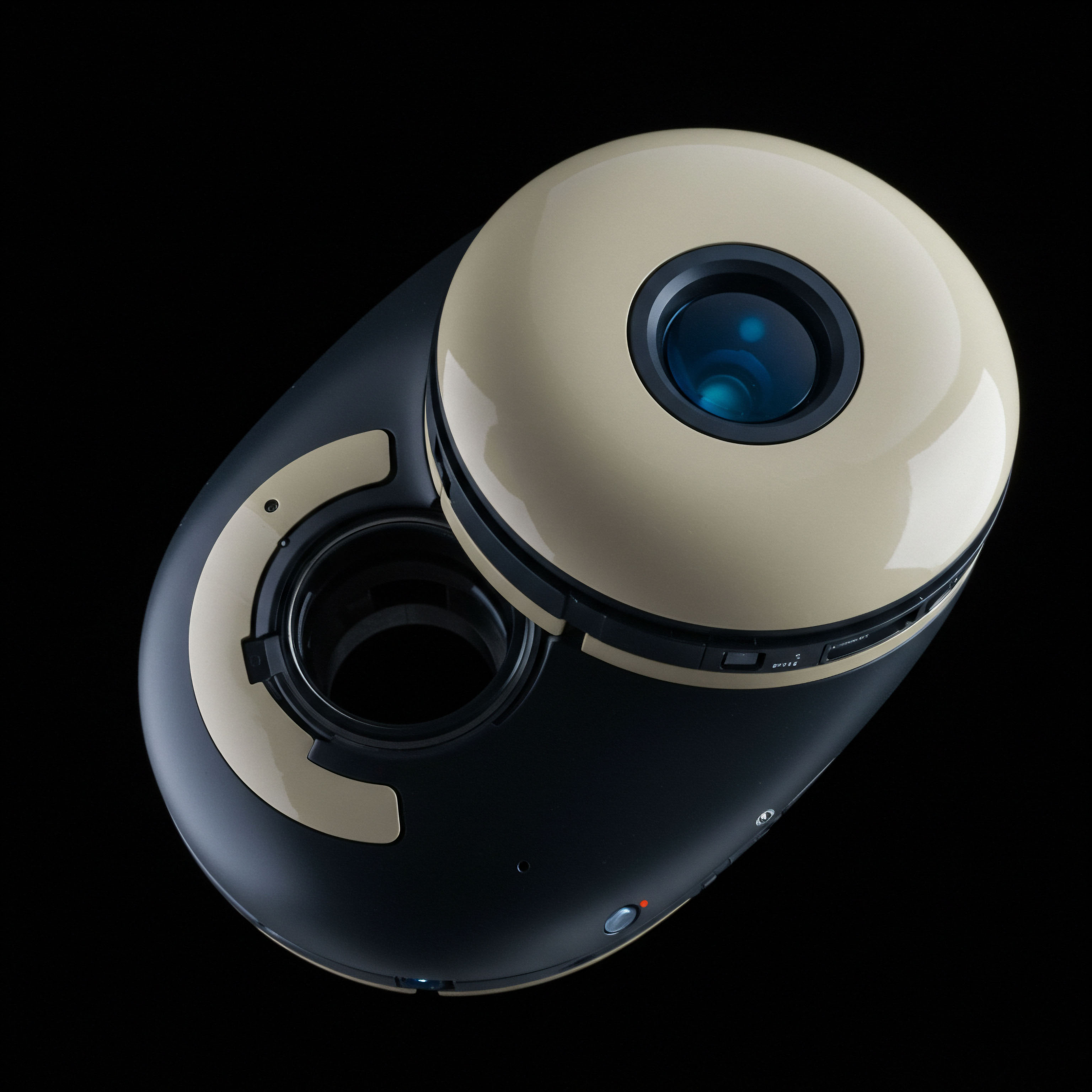 This high contrast visualization depicts a complex, dual-chambered mechanical-organic structure set against absolute black representing the void of off-chain data. The primary convex element, finished in a pale cerulean tone, suggests a lens or optical sensor, akin to monitoring order book depth or real-time volatility surfaces in high-frequency proprietary trading strategies. The interlocking lower section, rendered in deep obsidian and accented by beige structural supports, symbolizes the nested complexity of immutable smart contract deployment and layered synthetic asset creation. This modularity suggests fungible token standards interfacing with non-fungible derivative structures, possibly illustrating the physical manifestation of a distributed ledger technology governance mechanism or a novel automated market maker design optimized for delta-neutral hedging strategies against impermanent loss exposure in liquidity pools.