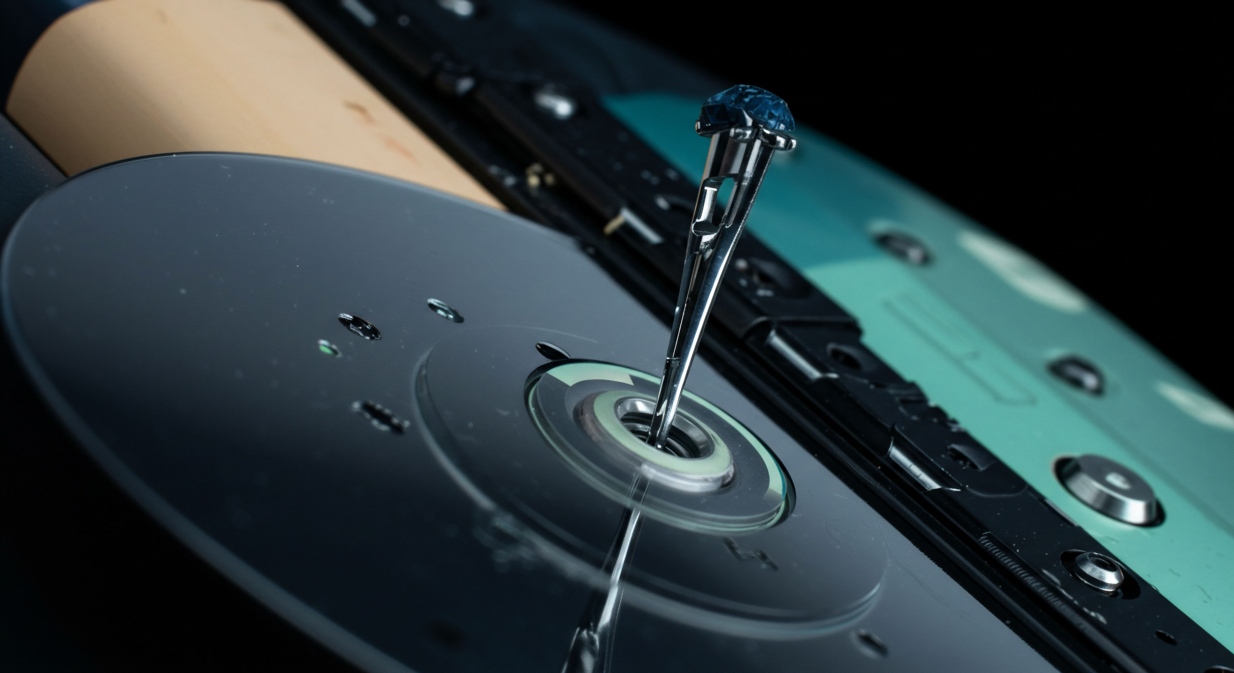 A highly polished metallic stylus tipped with a faceted dark sapphire structure pierces the center hub of a reflective platelike substrate resembling a data storage medium or perhaps a serialized tokenized asset ledger entry. The composition implies precise entry or calibration within a system characterized by low latency execution. This visual metaphor suggests the immutable finality of blockchain settlement underpinning complex financial derivatives like synthetic futures or perpetual swaps navigating volatility risk premium through secure on chain custody mechanisms. The underlying turquoise substrate hints at distributed ledger technology infrastructure essential for robust counterparty risk management in decentralized finance DeFi protocols. Terms like strike price realization option premium netting and smart contract execution environment are evoked by this juxtaposition of precision tooling and reflective digital abstraction.