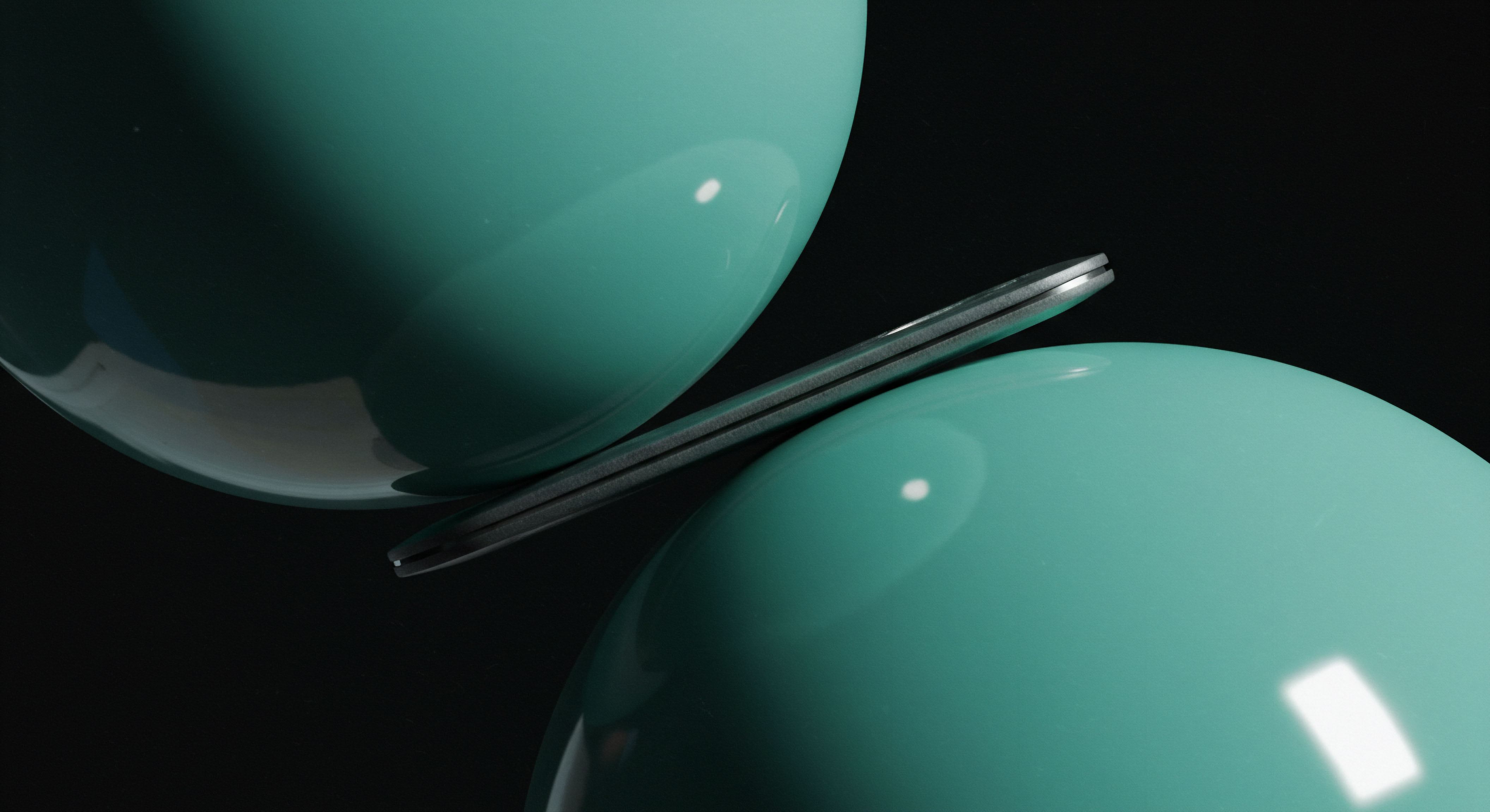 Two highly polished cyanoidal spherical volumes symmetrically compress a thin metallic sliver suggesting a constrained exchange mechanism. This visual metaphor encapsulates the precarious equilibrium of a leveraged synthetic asset where underlying asset volatility dictates pricing dynamics. The sliver represents a constrained notional principal caught between opposing liquidity provisions mimicking margin calls or collateral adjustments in perpetual futures contracts. High sheen reflections denote market transparency versus opaque counterparty risk inherent in decentralized finance settlement layers. This scenario models the challenge of maintaining delta neutrality when managing options delta hedging across volatile crypto asset pairs, emphasizing strike price precision and rapid liquidation thresholds observed in DeFi option vaults.