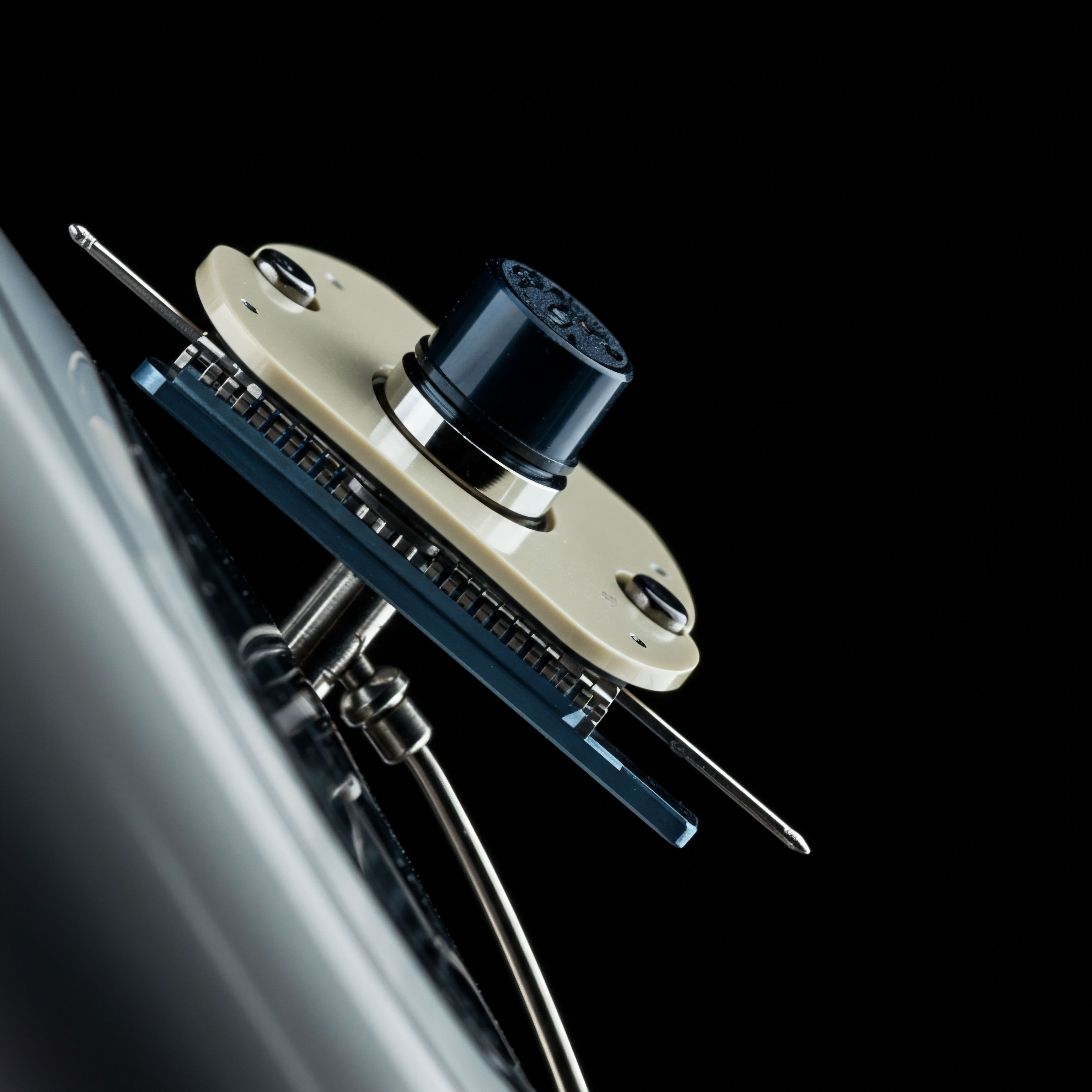 This macro-shot depicts a complex electromechanical component, possibly a microscopic sensor array or a precision actuator, set against a high-contrast black background, suggesting a sophisticated, high-frequency trading infrastructure element. The beige plate, bolted structure, and dark central element resemble a critical node in a permissioned or trustless system, analogous to a hardware security module securing private keys for off-chain collateral settlement or an oracle input mechanism. The protruding metallic filaments evoke data pathways or signal transduction critical for triggering derivative payouts, referencing smart contract execution integrity, basis risk quantification, and latency-sensitive settlement protocols governing perpetual swaps or options expiration fidelity in DeFi. This object symbolizes the tangible hardware underpinning abstract financial engineering.