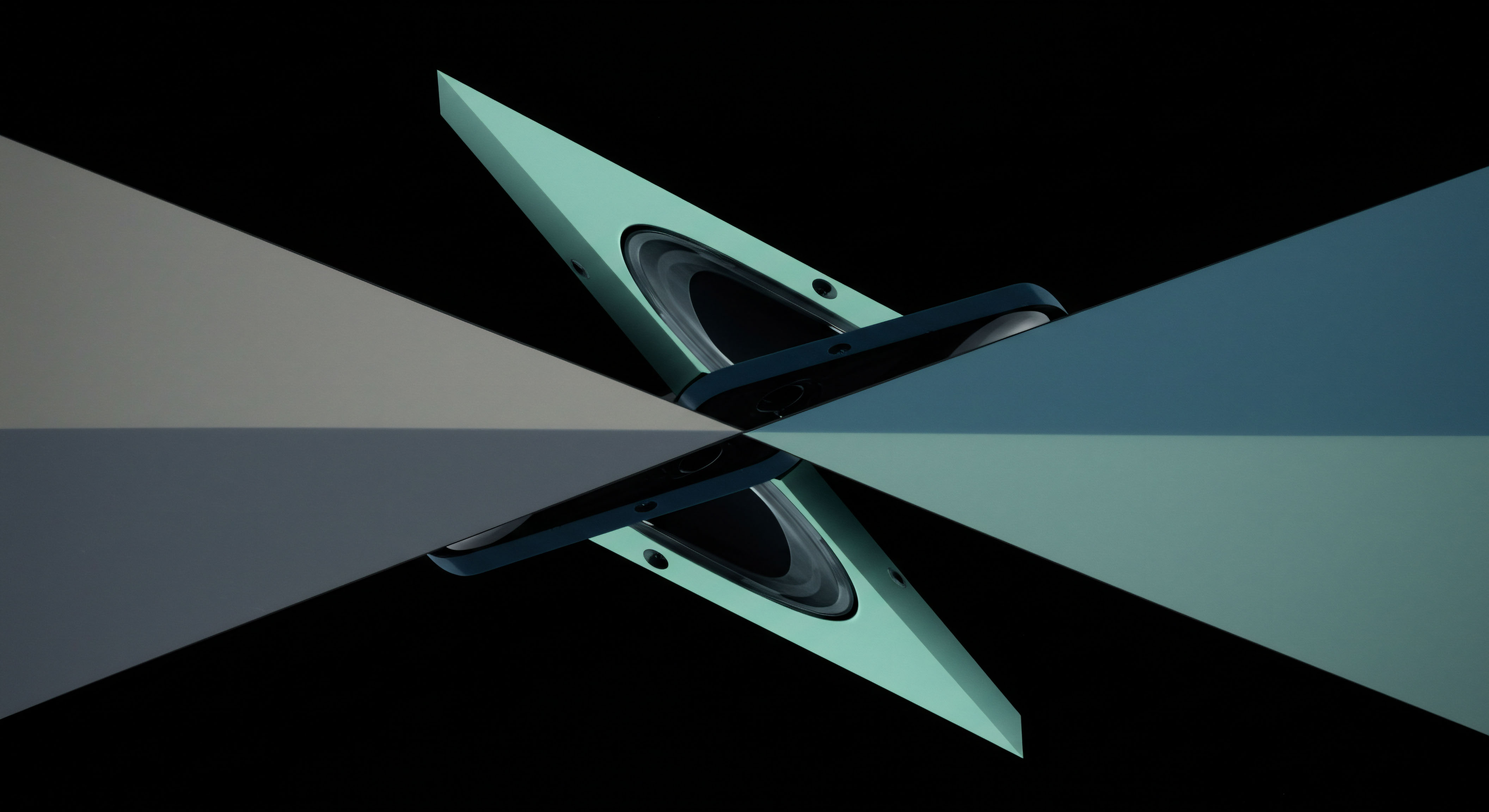 This visualization suggests a complex mirroring suggesting underlying market structure akin to hedging synthetic positions across perpetual swaps and options clearinghouses. The central object, resembling a transceiver component or liquidity pool node, is bisected by orthogonal light beams indicating bifurcation in capital allocation strategies. The aqua/teal planar elements suggest leveraged positions navigating stochastic volatility models influencing strike price perception. This composition evokes the arbitrage potential between spot exchange pricing and off-exchange derivative execution, specifically highlighting the transient nature of realized versus implied volatility across DeFi yield farming protocols. It conceptually models risk parity allocation strategies balancing delta exposure against theta decay in leveraged token structures.