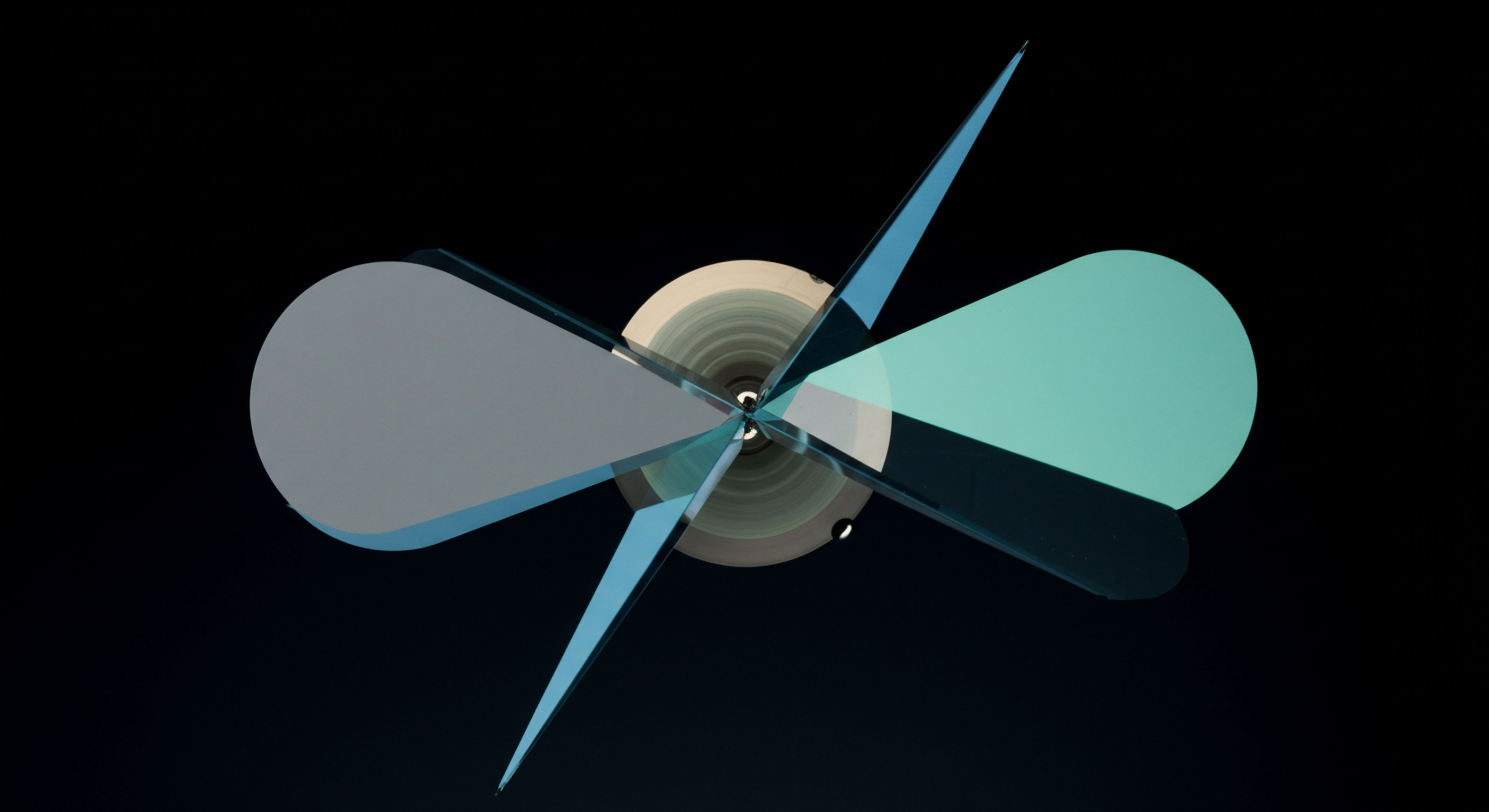 The graphic presents an abstract, radially symmetrical construct against deep void, suggesting vortex dynamics inherent in high-frequency quantitative trading structures. Translucent, overlapping geometric planes in cyan and muted gray emanate from a central nexus representing a core settlement layer or liquidity pool. This configuration models the instantaneous state of implied volatility skew across various strike prices, analogous to the curvature of a complex options pricing model like Black Scholes extended for digital assets. The sharp, angled projections might symbolize aggressive bid ask spreads or directional delta hedging strategies deployed against underlying blockchain asset fluctuations. It captures the ephemeral nature of arbitrage opportunities within decentralized finance perpetual swaps mechanisms and the complex interplay of Gamma exposure.