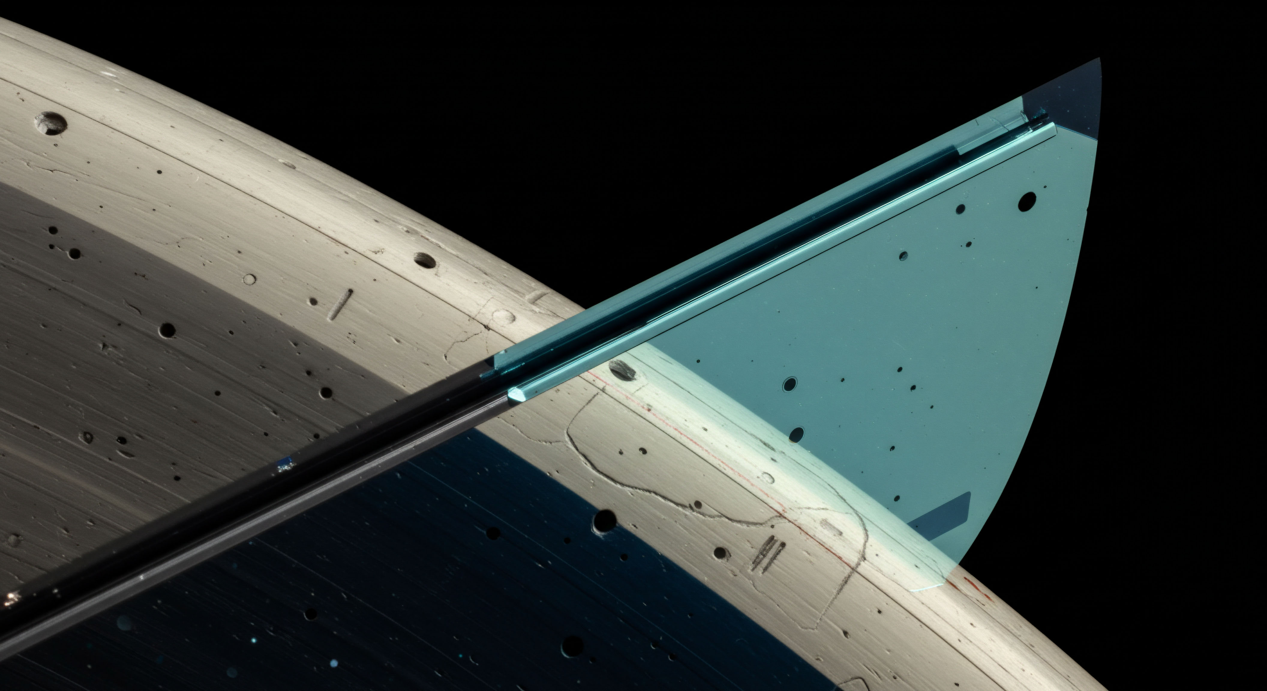 This abstract macro view displays intersecting planes with surface striations and scattered micromarkings against absolute black suggesting a complex ledger or computational substrate. The overlapping semi-translucent cyan plane intersecting the pale textured body evokes concepts of layered market structure in decentralized finance DeFi. Specifically, this represents the interplay between underlying spot asset valuation and the implied volatility skew observable in perpetual futures contracts and high-strike call options. Analyzing this visual juxtaposition relates to calibrating risk parameters for automated market maker AMM liquidity provision and managing systemic risk associated with high-frequency algorithmic trading strategies employing complex option Greeks like Vega exposure and Theta decay assessments within regulated crypto derivatives exchanges.